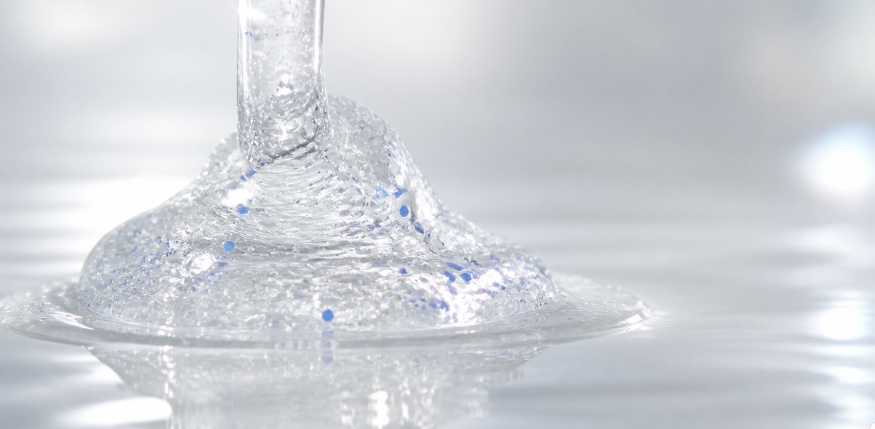 Silvery translucent HydroFoliate gel with micro-bubbles and suspended blue particles